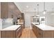 Modern kitchen features light wood cabinets, stainless steel appliances, a large island, and subway tile backsplash at 367 Parkway Ne Dr # 3, Atlanta, GA 30312