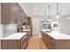 A modern kitchen features gray cabinets, stainless appliances, subway tile backsplash, and quartz countertops at 367 Parkway Ne Dr # 3, Atlanta, GA 30312