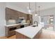 Modern eat-in kitchen with quartz countertops, stainless steel appliances, and designer pendant lighting at 367 Parkway Ne Dr # 3, Atlanta, GA 30312