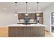 Modern eat-in kitchen with quartz countertops, stainless steel appliances, and designer pendant lighting at 367 Parkway Ne Dr # 3, Atlanta, GA 30312