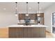 Modern kitchen featuring a large island, stainless steel appliances, and stylish pendant lights at 367 Parkway Ne Dr # 3, Atlanta, GA 30312