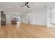 Open-concept living space with hardwood floors, recessed lights, and a modern kitchen island at 367 Parkway Ne Dr # 3, Atlanta, GA 30312