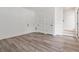A well-lit living room showcasing laminate flooring, neutral decor, and modern doors at 367 Parkway Ne Dr # 3, Atlanta, GA 30312