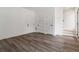 Bright living area featuring hardwood floors, modern trim and three doors at 367 Parkway Ne Dr # 3, Atlanta, GA 30312