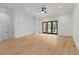 Spacious living area featuring hardwood floors, recessed lighting, and contemporary doors at 367 Parkway Ne Dr # 3, Atlanta, GA 30312