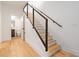 A modern staircase features hardwood treads, sleek black railings, and wire balusters at 367 Parkway Ne Dr # 3, Atlanta, GA 30312