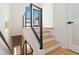 Modern staircase with wooden steps and a sleek metal railing at 367 Parkway Ne Dr # 3, Atlanta, GA 30312