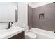 Modern bathroom featuring stylish vanity, tiled wall accents, and bathtub at 367 Parkway Ne Dr # 6, Atlanta, GA 30312