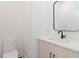 Stylish half-bathroom with a modern vanity, black faucet, framed mirror, and toilet at 367 Parkway Ne Dr # 6, Atlanta, GA 30312