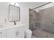 Bathroom featuring a shower with gray tiling, glass door, and modern vanity at 367 Parkway Ne Dr # 6, Atlanta, GA 30312