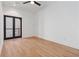 Bright bedroom with hardwood floors, white walls, and access to a balcony through sliding glass doors at 367 Parkway Ne Dr # 6, Atlanta, GA 30312