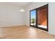 Cozy bedroom with hardwood floors, modern lighting fixture, and access to a balcony at 367 Parkway Ne Dr # 6, Atlanta, GA 30312