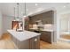 Modern kitchen with stainless steel appliances, an island, and stylish pendant lights at 367 Parkway Ne Dr # 6, Atlanta, GA 30312