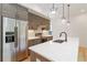 Charming kitchen featuring stainless steel appliances, wood cabinets, white subway tile backsplash, and an island with a white countertop at 367 Parkway Ne Dr # 6, Atlanta, GA 30312