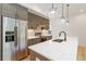 Bright kitchen featuring stainless steel appliances, white countertop and modern lighting fixtures at 367 Parkway Ne Dr # 6, Atlanta, GA 30312