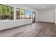 Bright living room with laminate floors, lots of windows and a door to the balcony at 367 Parkway Ne Dr # 6, Atlanta, GA 30312