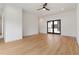 Open-concept living area with hardwood floors, a ceiling fan, and glass doors to the outside at 367 Parkway Ne Dr # 6, Atlanta, GA 30312