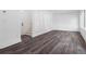 Bright living room featuring dark laminate floors and a staircase to the upper level at 367 Parkway Ne Dr # 6, Atlanta, GA 30312