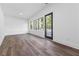 Bright living room with hardwood floors, lots of windows and a door to the balcony at 367 Parkway Ne Dr # 6, Atlanta, GA 30312