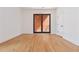 Spacious living room with hardwood floors and sliding door to the balcony at 367 Parkway Ne Dr # 6, Atlanta, GA 30312