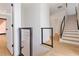 Modern staircase with wood treads, white risers, and a black metal railing, leading to the upper level at 367 Parkway Ne Dr # 6, Atlanta, GA 30312