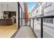 Balcony view looking into an open concept kitchen and the buildings exterior architecture at 367 Parkway Ne Dr # 9, Atlanta, GA 30312