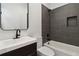 Modern bathroom featuring sleek vanity, mirror and tiled shower with a built-in niche at 367 Parkway Ne Dr # 9, Atlanta, GA 30312