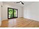This bright bedroom has hardwood floors and a glass door with a balcony at 367 Parkway Ne Dr # 9, Atlanta, GA 30312
