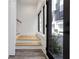 Home entrance with hardwood stairs and flooring and modern architectural features at 367 Parkway Ne Dr # 9, Atlanta, GA 30312