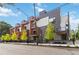 Modern townhomes with stylish gray and white exteriors, accented by wood trim and private balconies at 367 Parkway Ne Dr # 9, Atlanta, GA 30312