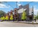Modern townhome exterior featuring a combination of gray siding, balconies, and professional landscaping at 367 Parkway Ne Dr # 9, Atlanta, GA 30312