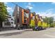 Modern townhome exterior featuring a combination of gray siding, balconies, and professional landscaping at 367 Parkway Ne Dr # 9, Atlanta, GA 30312