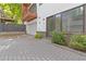 Attached garage and brick-paved driveway, complemented by manicured landscaping and a private balcony above at 367 Parkway Ne Dr # 9, Atlanta, GA 30312