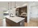 Kitchen with center island, stainless steel appliances, modern lighting and white subway tile backsplash at 367 Parkway Ne Dr # 9, Atlanta, GA 30312