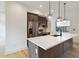 Modern kitchen with a large island, stainless steel appliances, and hardwood floors at 367 Parkway Ne Dr # 9, Atlanta, GA 30312