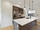 Modern kitchen with stainless steel appliances, white countertops, and stylish pendant lighting at 367 Parkway Ne Dr # 9, Atlanta, GA 30312