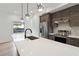 Modern kitchen features stainless steel appliances, custom cabinets, quartz countertops and pendant lighting at 367 Parkway Ne Dr # 9, Atlanta, GA 30312