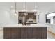 Modern kitchen island with pendant lighting, stainless steel appliances, and sleek countertops at 367 Parkway Ne Dr # 9, Atlanta, GA 30312