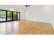 Bright, open-concept living space with hardwood floors and large sliding glass doors to outdoor living area at 367 Parkway Ne Dr # 9, Atlanta, GA 30312