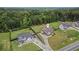 An aerial view highlights this charming home's location and the surrounding mature trees at 1660 Chandler Rd, Lawrenceville, GA 30045