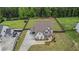 A stunning aerial perspective of a beautiful home, surrounded by a well-maintained yard and landscaping at 1660 Chandler Rd, Lawrenceville, GA 30045