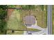 An aerial shot reveals a well-manicured property with a spacious lawn at 1660 Chandler Rd, Lawrenceville, GA 30045
