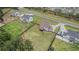 A high-angle aerial view features a large lot with a well-maintained lawn and mature trees in the background at 1660 Chandler Rd, Lawrenceville, GA 30045