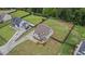Aerial view of a beautiful home with a large, fenced backyard and a long driveway; ample parking at 1660 Chandler Rd, Lawrenceville, GA 30045