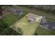 Aerial view of a property with a large backyard, fence, and proximity to neighborhood amenities and street access at 1660 Chandler Rd, Lawrenceville, GA 30045