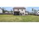 Expansive backyard with a covered patio, ideal for outdoor entertaining and relaxation at 1660 Chandler Rd, Lawrenceville, GA 30045