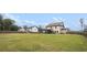 Large backyard with a lush lawn, privacy fence, patio, and plenty of space for outdoor activities at 1660 Chandler Rd, Lawrenceville, GA 30045