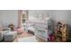 ' bedroom featuring a bunk bed, play area, rug, with decor and natural light at 1660 Chandler Rd, Lawrenceville, GA 30045