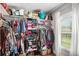 Spacious walk-in closet featuring custom shelving and ample storage space with window at 1660 Chandler Rd, Lawrenceville, GA 30045