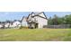 Beautiful two-story home with a manicured lawn, elegant landscaping, and an attached two-car garage at 1660 Chandler Rd, Lawrenceville, GA 30045